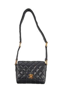 Lot 3 - A Chanel mini quilted navy lambskin leather flap bag, 1980s-early 1990s