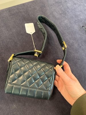 Lot 3 - A Chanel mini quilted navy lambskin leather flap bag, 1980s-early 1990s