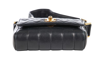 Lot 3 - A Chanel mini quilted navy lambskin leather flap bag, 1980s-early 1990s