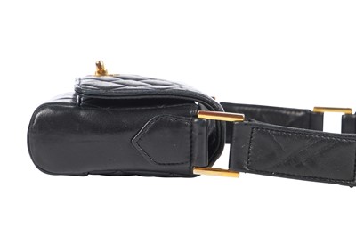 Lot 3 - A Chanel mini quilted navy lambskin leather flap bag, 1980s-early 1990s