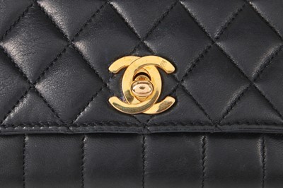 Lot 3 - A Chanel mini quilted navy lambskin leather flap bag, 1980s-early 1990s