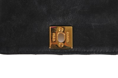 Lot 3 - A Chanel mini quilted navy lambskin leather flap bag, 1980s-early 1990s