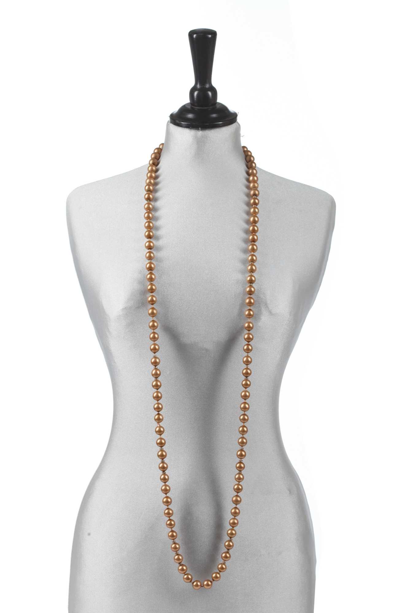 Lot 40 - A Chanel toasted-marshmallow 'pearl' sautoir, 1981