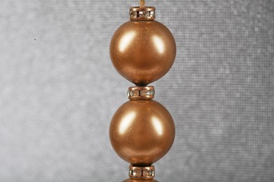 Lot 40 - A Chanel toasted-marshmallow 'pearl' sautoir, 1981