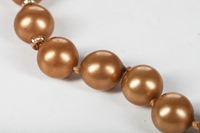 Lot 40 - A Chanel toasted-marshmallow 'pearl' sautoir, 1981