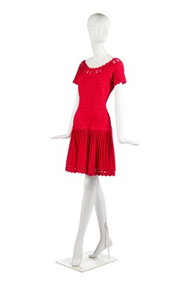 Lot 198 - An Hervé Léger raspberry-pink knitted spandex-blend cocktail dress, 1990s-2000s