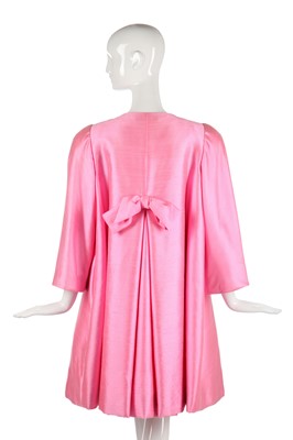Lot 175 - A Scaasi bubblegum-pink raw-silk tent-coat, 1980s in a 1960s style