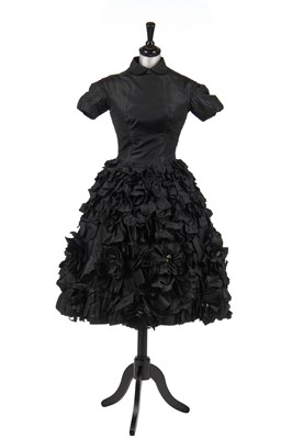 Lot 235 - An early Hubert de Givenchy black paper taffeta cocktail dress, circa 1952
