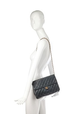 Lot 4 - A Chanel navy quilted lambskin leather flap bag, probably 1980s