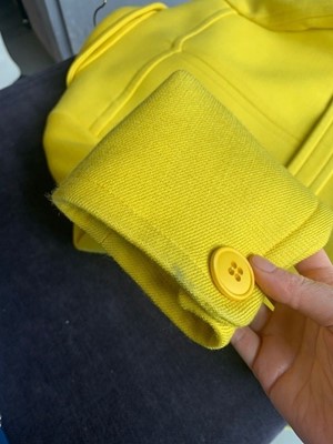Lot 301 - A Courrèges lemon-yellow wool double-breasted coat, circa 1967
