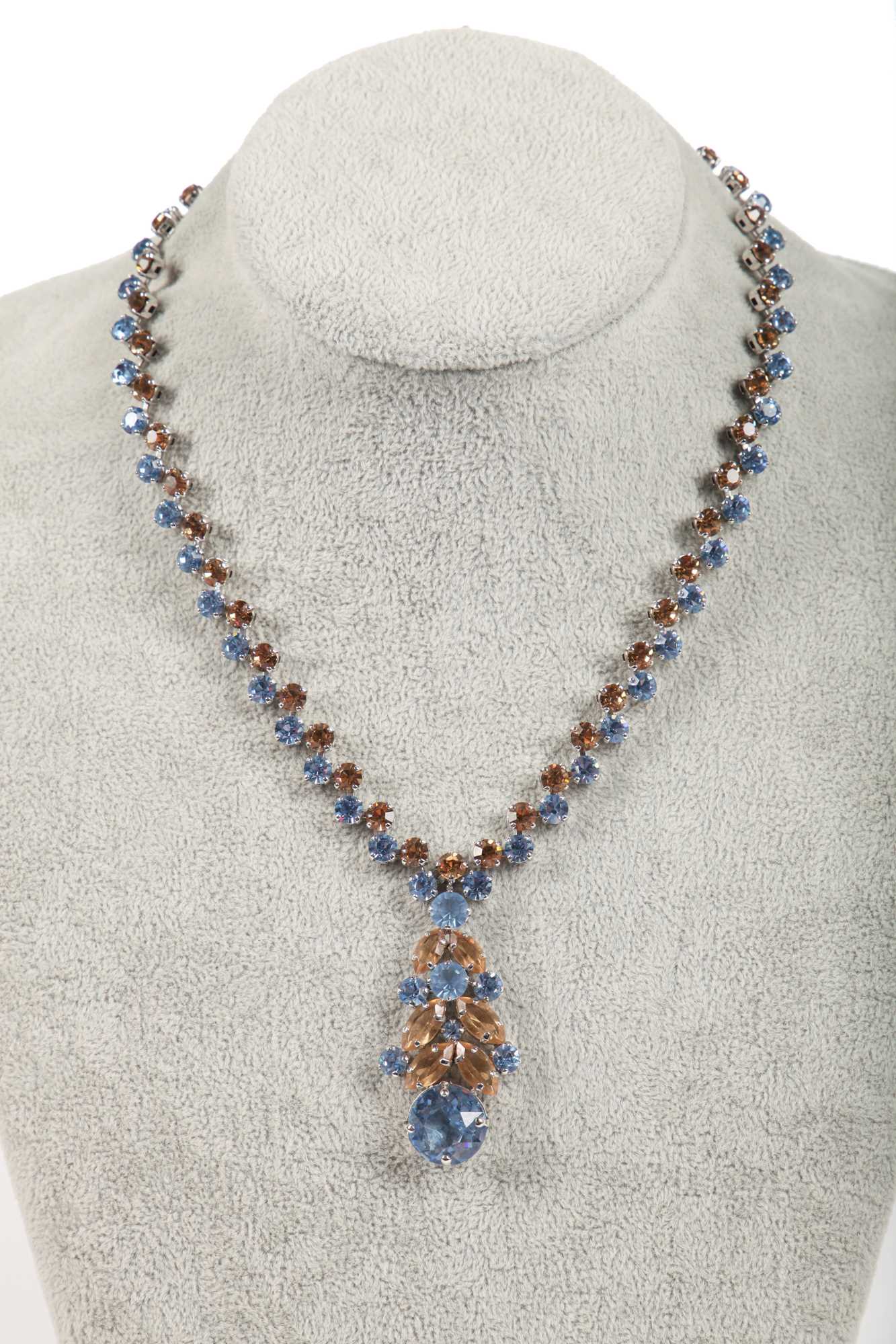 Lot 47 - A Dior necklace of faceted sky-blue and smoky glass cut-brilliants, 1961