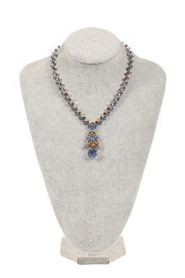 Lot 47 - A Dior necklace of faceted sky-blue and smoky glass cut-brilliants, 1961
