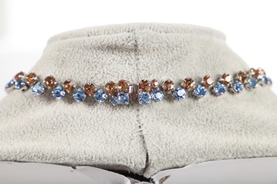 Lot 47 - A Dior necklace of faceted sky-blue and smoky glass cut-brilliants, 1961