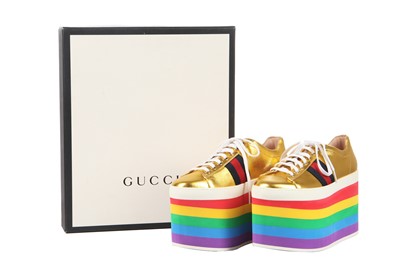 Lot 100 - A pair of Gucci gold leather trainers with rainbow foam platform soles, Resort 2017 collection