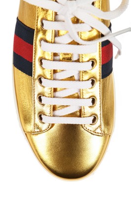 Lot 100 - A pair of Gucci gold leather trainers with rainbow foam platform soles, Resort 2017 collection