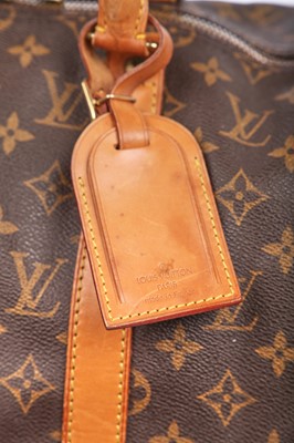 Lot 58 - Three Louis Vuitton monogrammed canvas leather holdalls