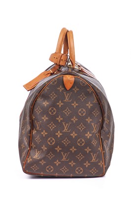 Lot 58 - Three Louis Vuitton monogrammed canvas leather holdalls