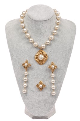 Lot 13 - A Chanel 'pearl' necklace with gilt metal diamond-shaped medallion with scroll work, circa 1990