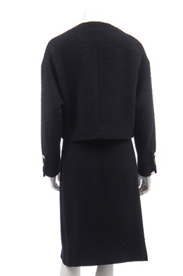 Lot 18 - A Chanel black bouclé wool suit, 1980s