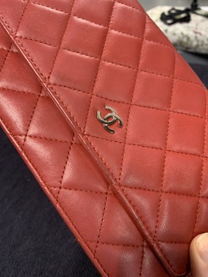 Lot 4 - A Chanel quilted red lambskin leather WOC, 2014