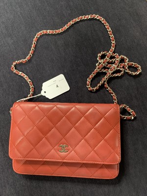 Lot 4 - A Chanel quilted red lambskin leather WOC, 2014