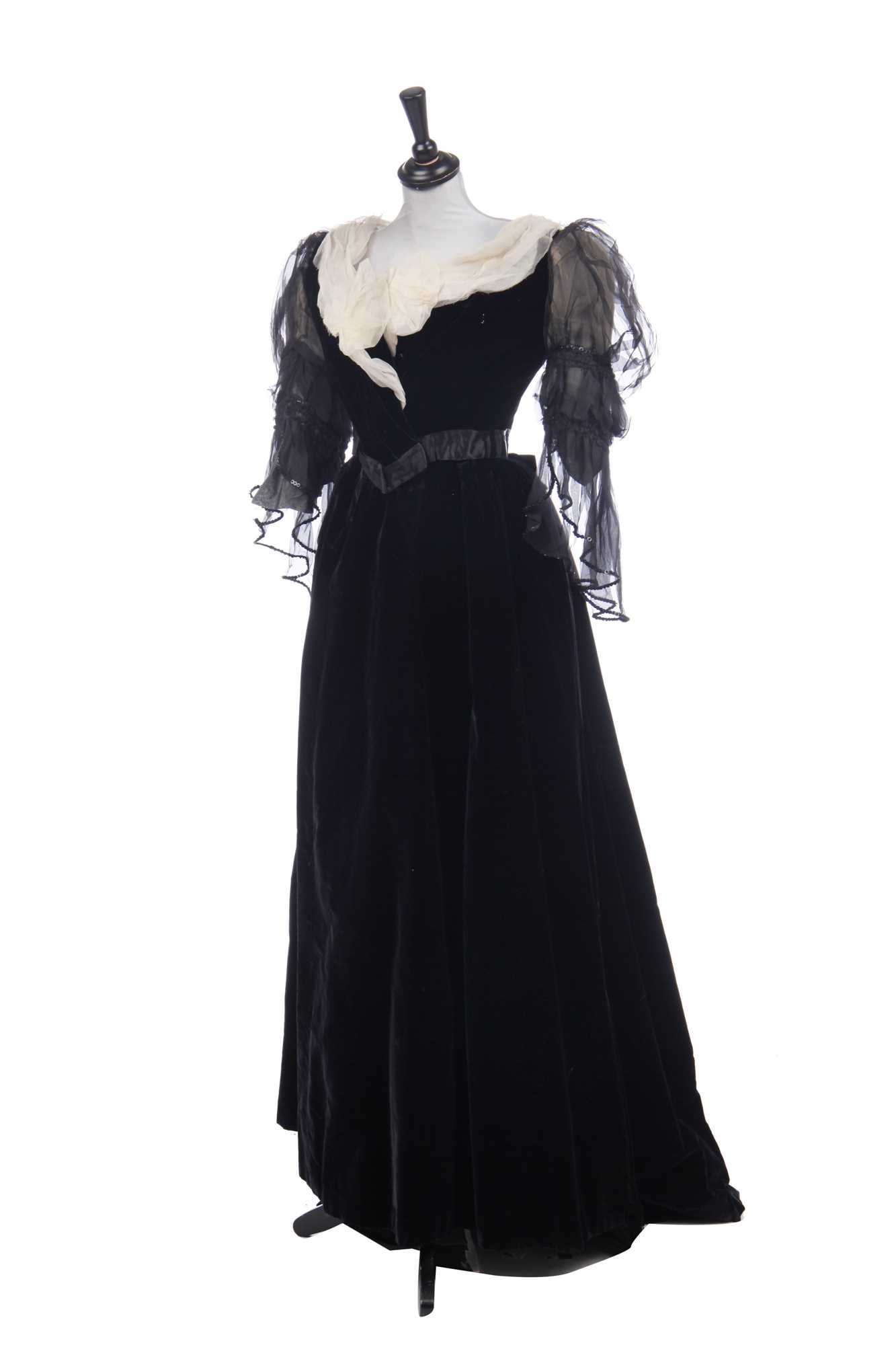 Lot 413 - An Alfred Manning of Dublin black velvet evening gown with three bodices, circa 1900