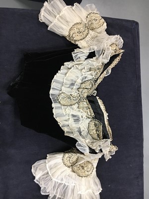 Lot 413 - An Alfred Manning of Dublin black velvet evening gown with three bodices, circa 1900
