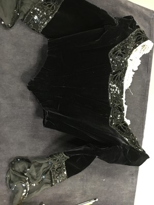 Lot 413 - An Alfred Manning of Dublin black velvet evening gown with three bodices, circa 1900
