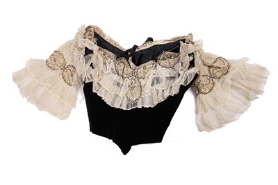 Lot 413 - An Alfred Manning of Dublin black velvet evening gown with three bodices, circa 1900