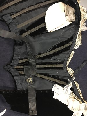 Lot 413 - An Alfred Manning of Dublin black velvet evening gown with three bodices, circa 1900