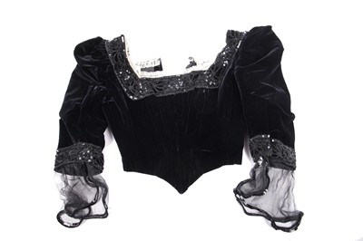 Lot 413 - An Alfred Manning of Dublin black velvet evening gown with three bodices, circa 1900