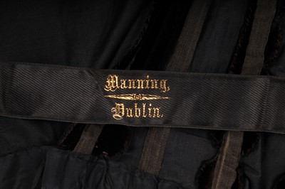 Lot 413 - An Alfred Manning of Dublin black velvet evening gown with three bodices, circa 1900
