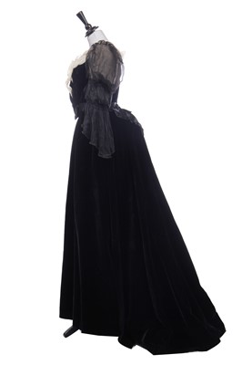 Lot 413 - An Alfred Manning of Dublin black velvet evening gown with three bodices, circa 1900
