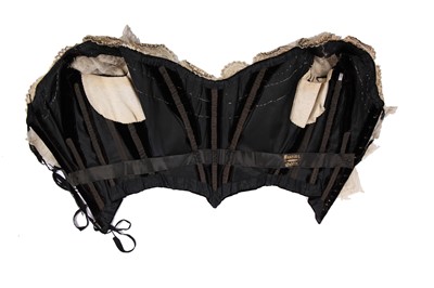 Lot 413 - An Alfred Manning of Dublin black velvet evening gown with three bodices, circa 1900