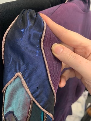 Lot 267 - A group of clothing in shades of purple, black and blue, 1970s-early 1980s