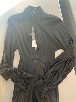 Lot 267 - A group of clothing in shades of purple, black and blue, 1970s-early 1980s