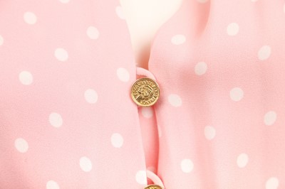 Lot 43 - A Chanel polka-dot printed pink crêpe dress, 1980s