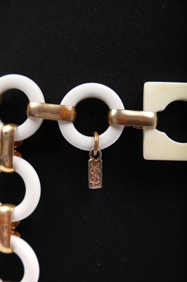 Lot 261 - An Yves Saint Laurent plastic and gilt linked belt, circa 1970