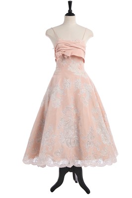 Lot 234 - A pink silk and lace evening gown, circa 1956