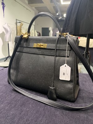 Lot 48 - An Hermès black Fjord leather Retourné Kelly 32, 1990
