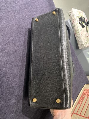 Lot 48 - An Hermès black Fjord leather Retourné Kelly 32, 1990