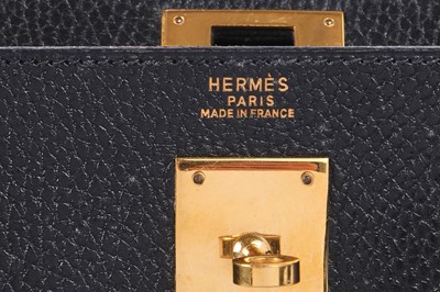 Lot 48 - An Hermès black Fjord leather Retourné Kelly 32, 1990