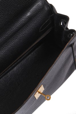Lot 48 - An Hermès black Fjord leather Retourné Kelly 32, 1990