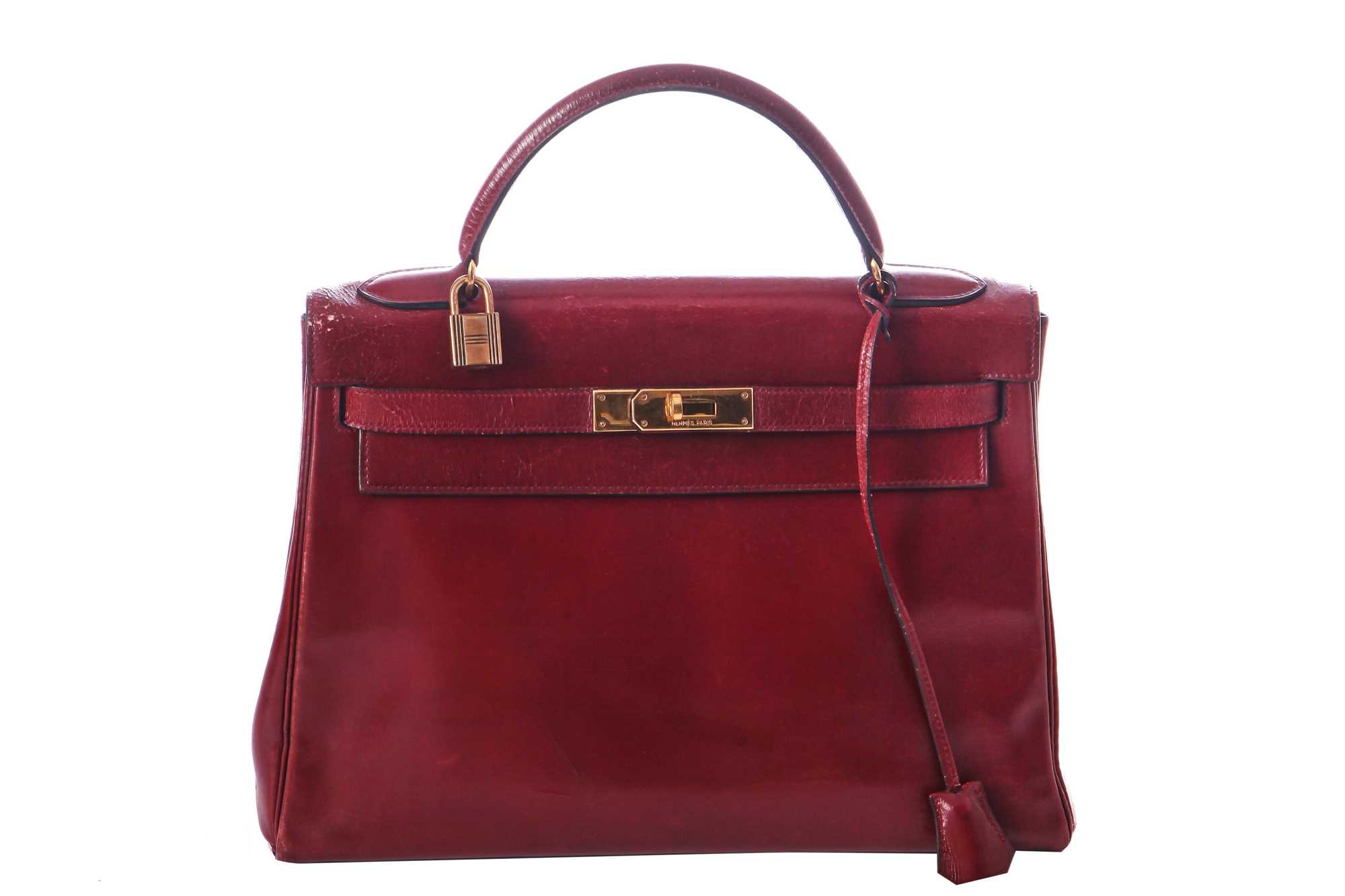 Lot 49 - An Hermès oxblood Box leather Retourné Kelly 32, 1978