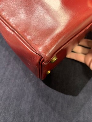Lot 49 - An Hermès oxblood Box leather Retourné Kelly 32, 1978