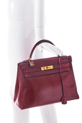 Lot 49 - An Hermès oxblood Box leather Retourné Kelly 32, 1978
