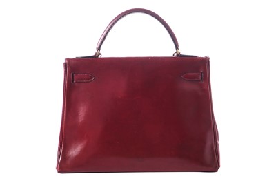 Lot 49 - An Hermès oxblood Box leather Retourné Kelly 32, 1978