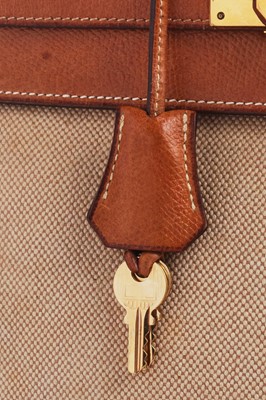 Lot 47 - An Hermès canvas and natural leather Retourné Kelly 28, 1979