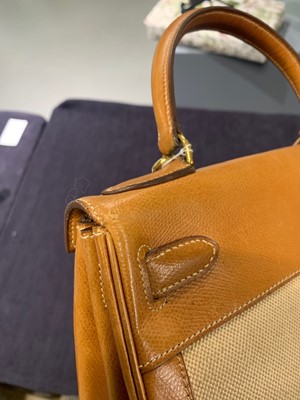 Lot 47 - An Hermès canvas and natural leather Retourné Kelly 28, 1979