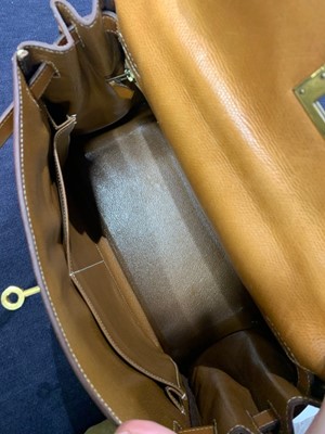 Lot 47 - An Hermès canvas and natural leather Retourné Kelly 28, 1979